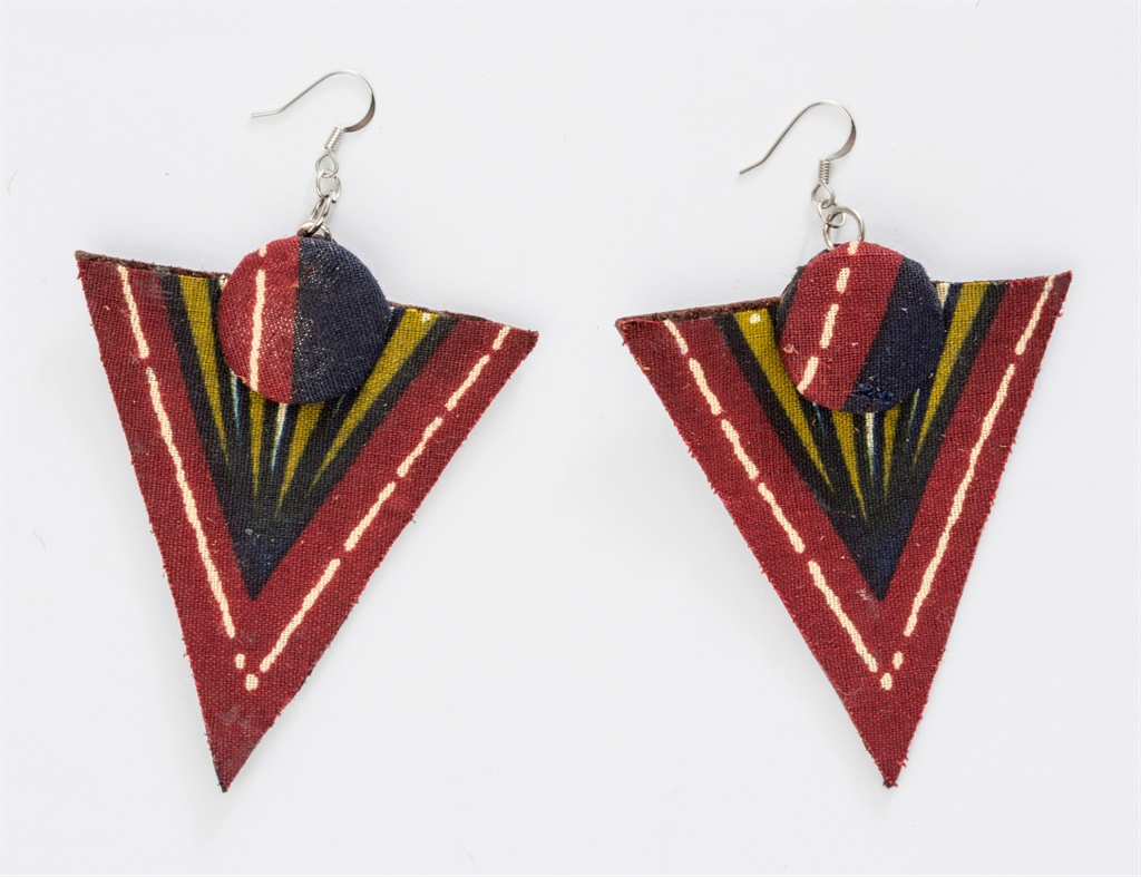 Printed fabric and leather triangle drop earrings in deep red with a geometric pattern